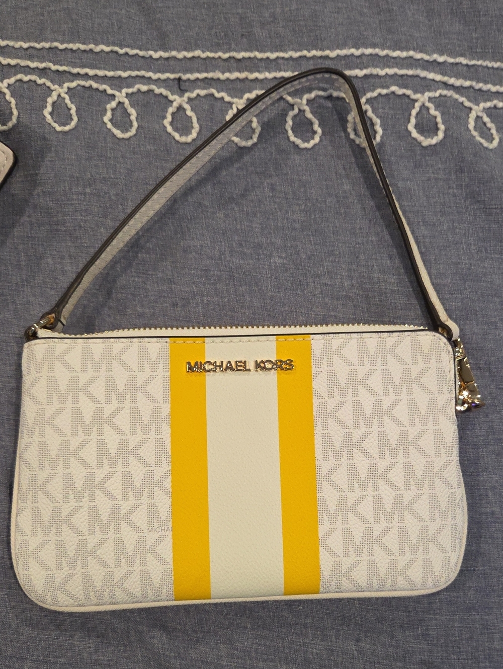 Michael Kors White Wristlet with Yellow Stripe Accent